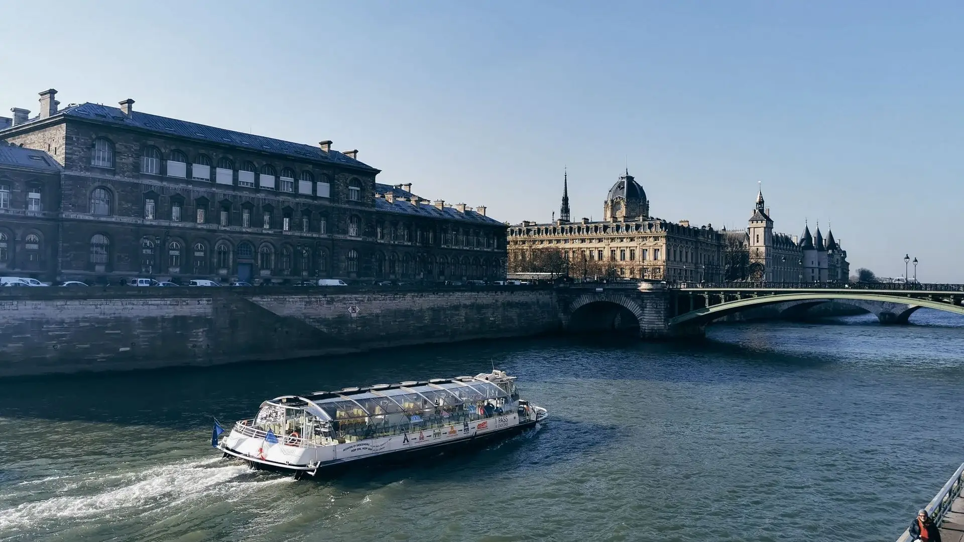 Glass-sided river boat on the Seine passing the Île de la Cité